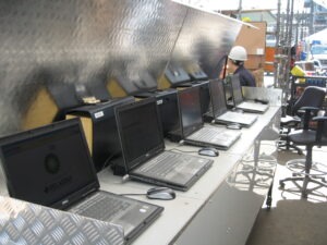 laptops lined up with BP and telaeris logos on them